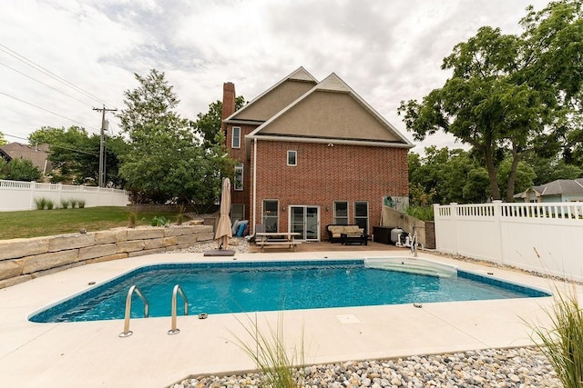 view of swimming pool featuring a patio area