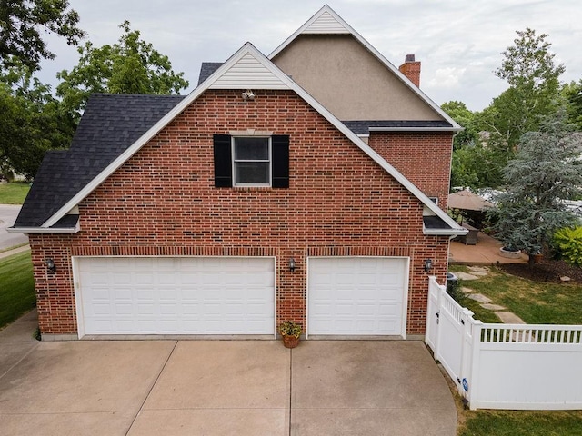 view of property exterior with a garage