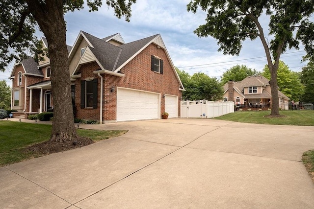 view of front of home with a garage and a front yard