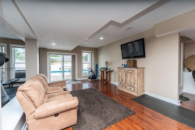 living room with dark hardwood / wood-style floors