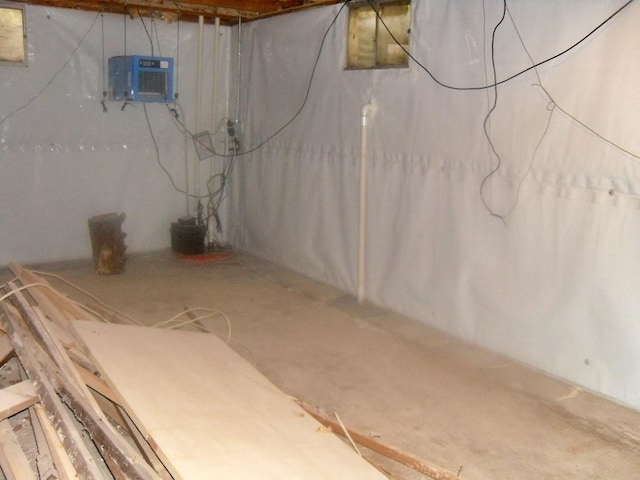 basement with a wall mounted AC