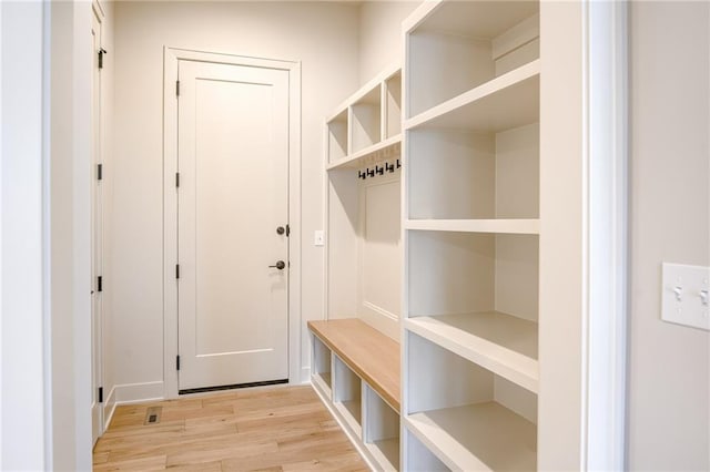 mudroom with light wood-style flooring