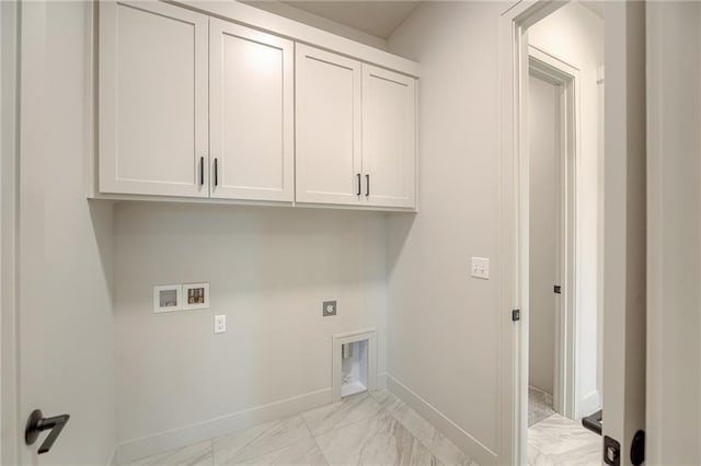 clothes washing area featuring marble finish floor, hookup for an electric dryer, washer hookup, and cabinet space