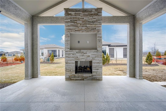 view of patio / terrace with an outdoor stone fireplace