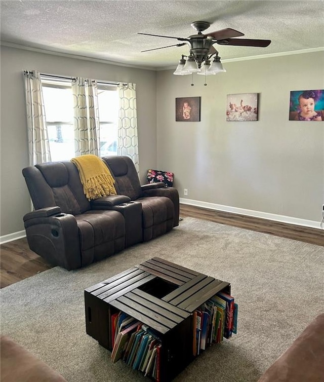 living room with a textured ceiling and ornamental molding