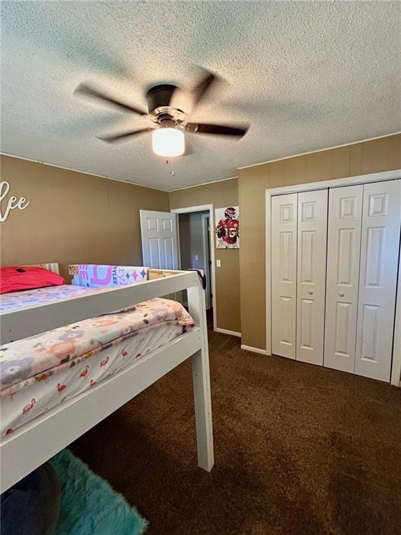 carpeted bedroom with a closet and ceiling fan