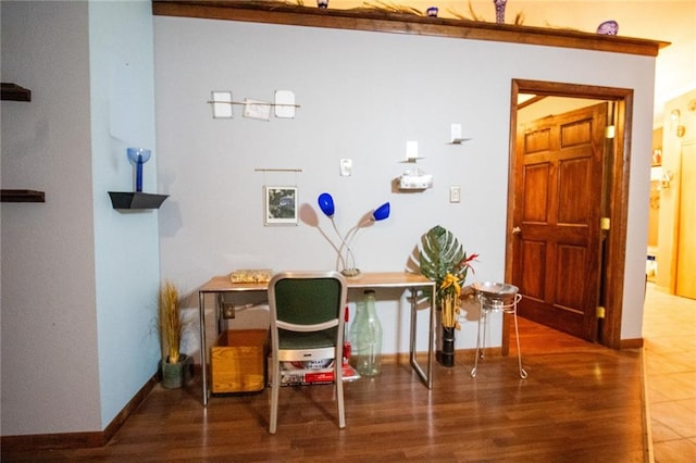 home office with hardwood / wood-style flooring