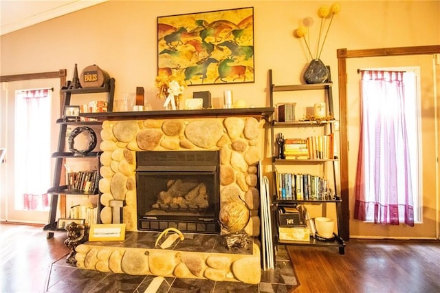 interior space featuring wood-type flooring and a fireplace