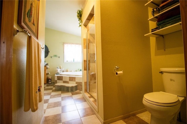 bathroom featuring tile flooring, toilet, and plus walk in shower