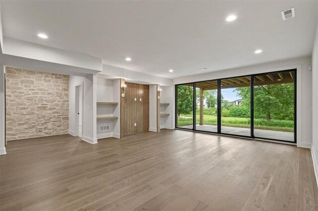 8736 N Lewis Ave, Kansas City, MO 64157 - unfurnished living room featuring wood finished floors, recessed lighting, and baseboards