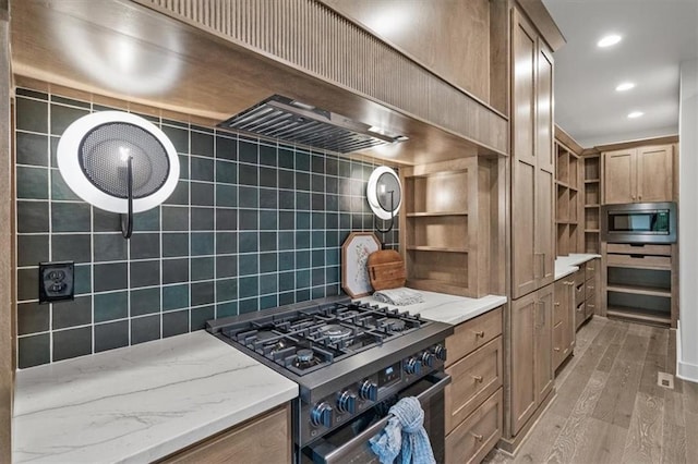 8736 N Lewis Ave, Kansas City, MO 64157 - kitchen with double oven range, open shelves, stainless steel microwave, light wood-type flooring, and light stone counters
