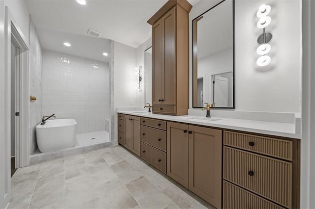 8736 N Lewis Ave, Kansas City, MO 64157 - full bathroom with a walk in shower, double vanity, a soaking tub, and recessed lighting