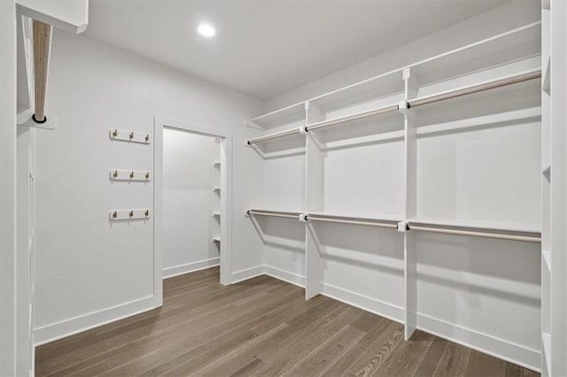8736 N Lewis Ave, Kansas City, MO 64157 - spacious closet featuring wood finished floors
