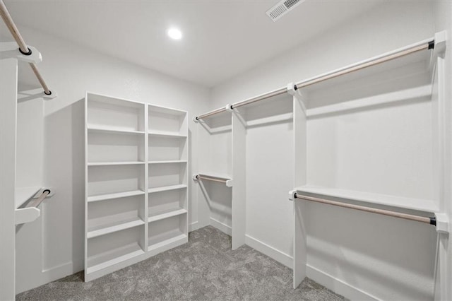 8736 N Lewis Ave, Kansas City, MO 64157 - walk in closet featuring carpet