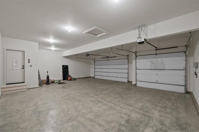 8736 N Lewis Ave, Kansas City, MO 64157 - garage featuring a garage door opener and baseboards