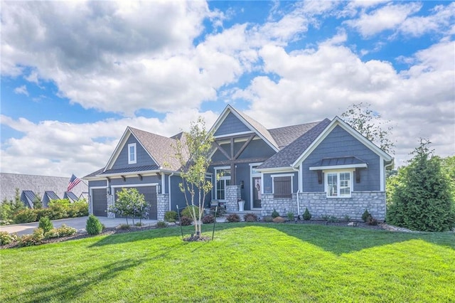 craftsman-style house with a garage and a front lawn