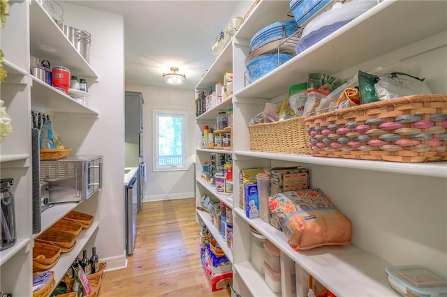 pantry featuring wine cooler