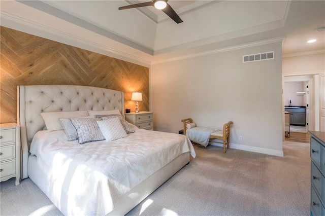 carpeted bedroom featuring ceiling fan and ornamental molding