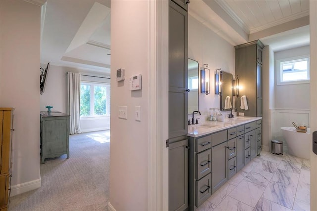 bathroom with dual vanity, crown molding, tile patterned flooring, and a tray ceiling