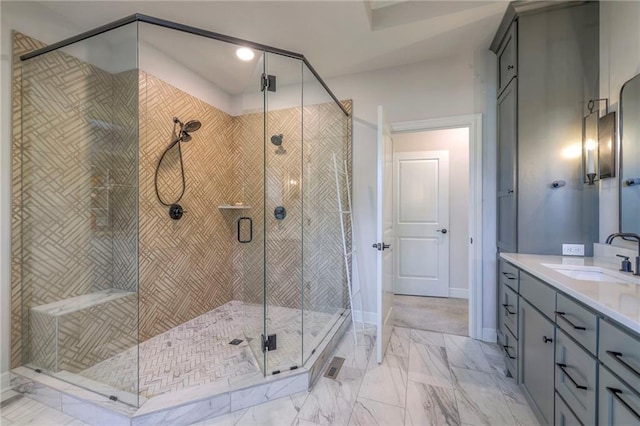 bathroom with tile patterned floors, a shower with door, and vanity