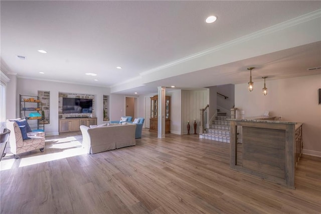 living room featuring ornamental molding and hardwood / wood-style flooring