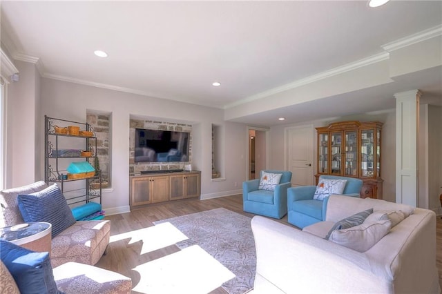 living room featuring crown molding and light wood-type flooring