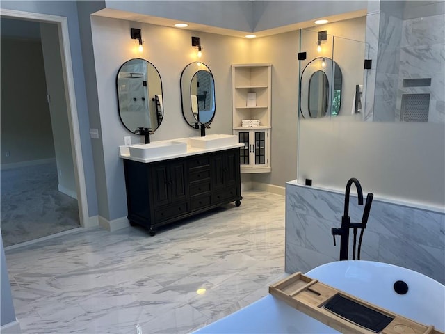 bathroom featuring vanity and a washtub