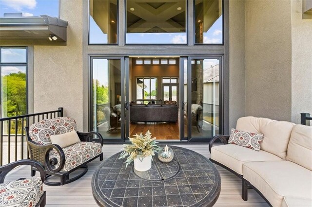 6101 NW 58th St, Kansas City, MO 64151 - view of exterior entry with outdoor lounge area and stucco siding