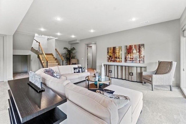 6101 NW 58th St, Kansas City, MO 64151 - living room with light carpet, stairway, recessed lighting, and baseboards