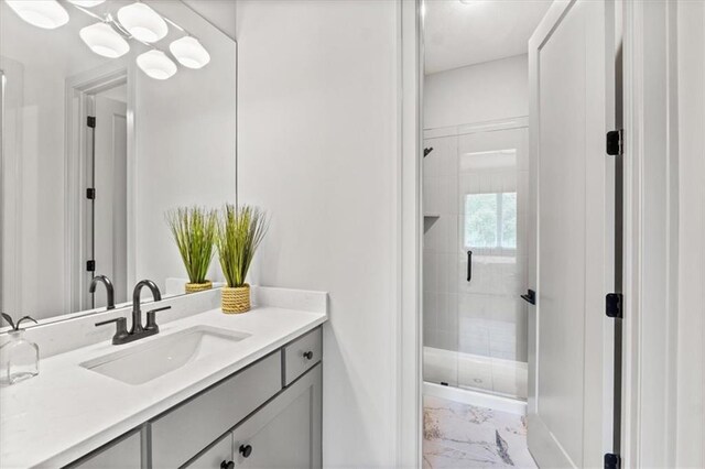 6101 NW 58th St, Kansas City, MO 64151 - bathroom featuring marble finish floors, a stall shower, vanity, and baseboards