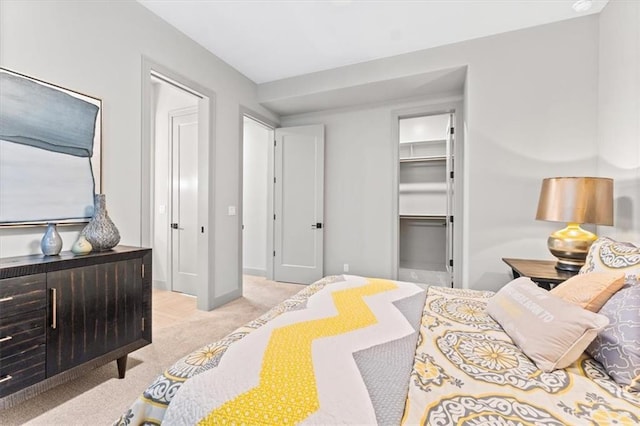 6101 NW 58th St, Kansas City, MO 64151 - carpeted bedroom with a walk in closet and baseboards