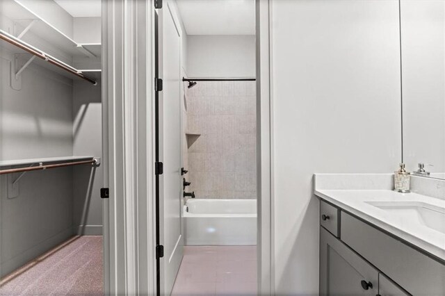 6101 NW 58th St, Kansas City, MO 64151 - full bath with a walk in closet, vanity, and bathtub / shower combination