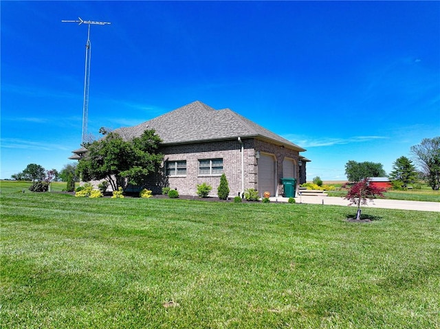 view of side of home featuring a garage and a lawn