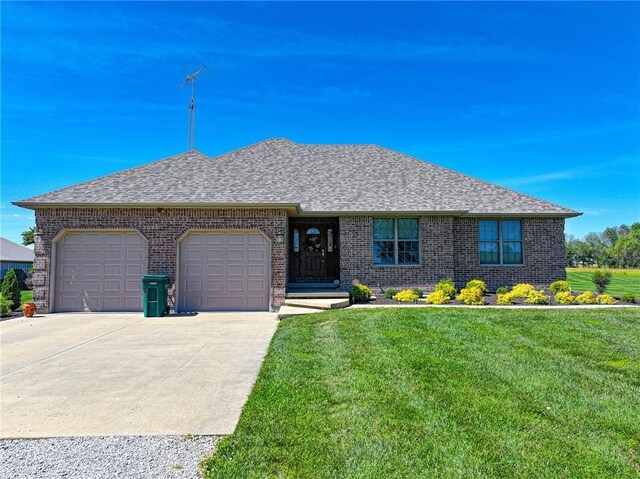 ranch-style home with a front yard and a garage