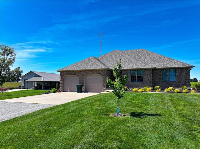 view of front facade with a garage and a front yard