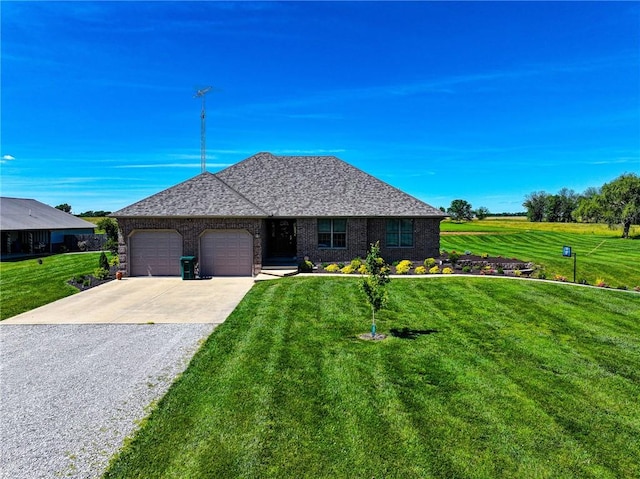 view of front of property with a garage and a front yard