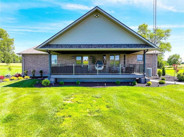 back of property featuring a lawn