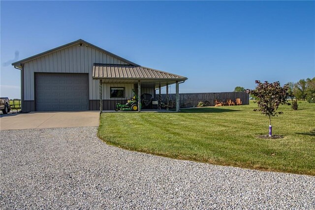 view of front of property with a front yard and a garage