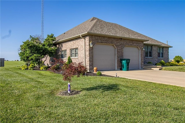 view of front of home featuring a front lawn and a garage