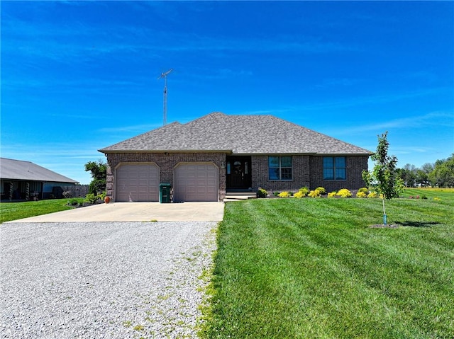 ranch-style home with a garage and a front lawn