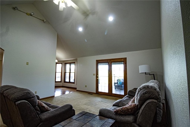 carpeted living room with lofted ceiling and ceiling fan