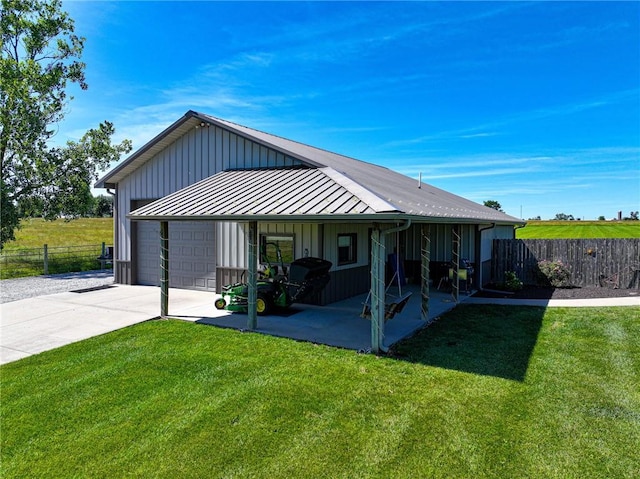 exterior space with a garage and a front lawn