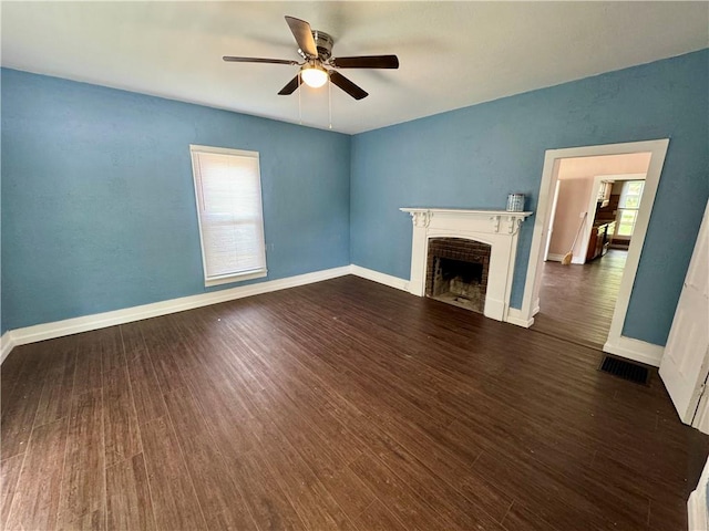 unfurnished living room with ceiling fan and dark hardwood / wood-style flooring