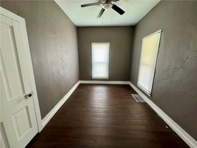 empty room featuring ceiling fan and hardwood / wood-style floors