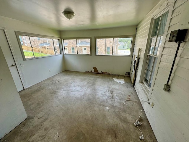 unfurnished sunroom featuring plenty of natural light