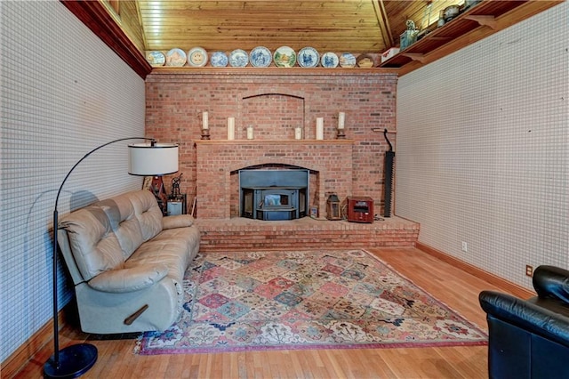 living room featuring hardwood / wood-style flooring and a wood stove