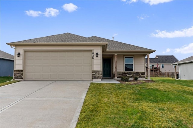 view of front of property with a garage and a front lawn