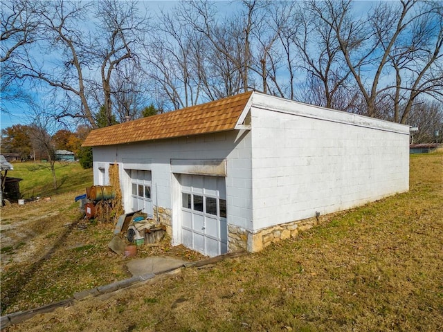 garage with a lawn