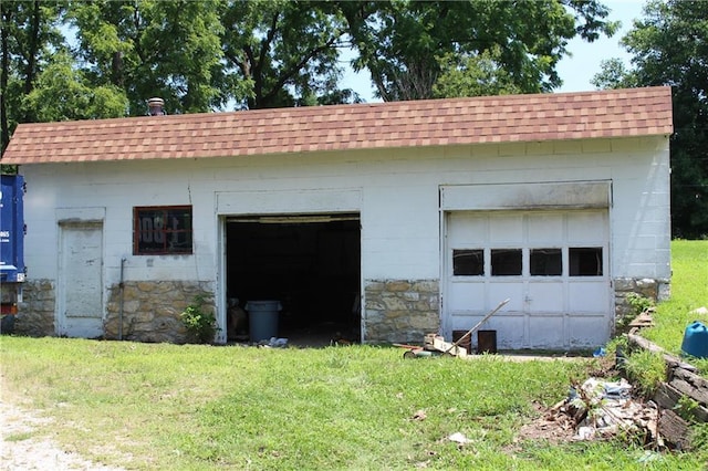 garage with a yard