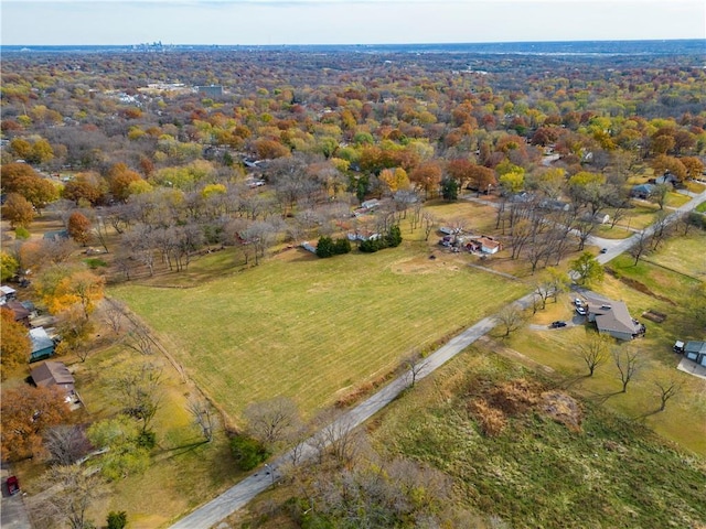 birds eye view of property with a rural view